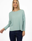 Model in studio wearing Dippy Long Sleeve Tee in Surf Green with Idol Jean, close-up front view