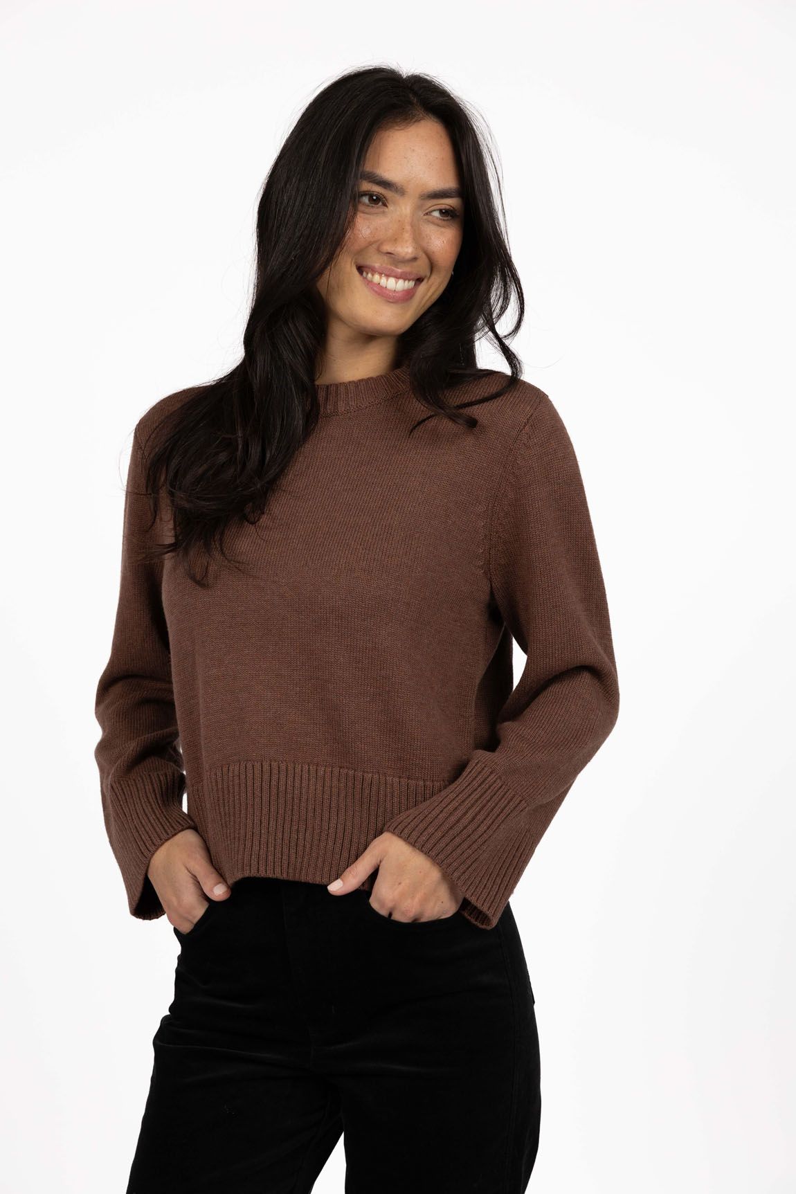Model in studio wearing Rexie Jumper in Mocha with Va Va Velour Pant in Black, close-up front view  