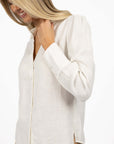 Model in studio wearing Pixie Shirt in White, close-up front view showing relaxed fit 