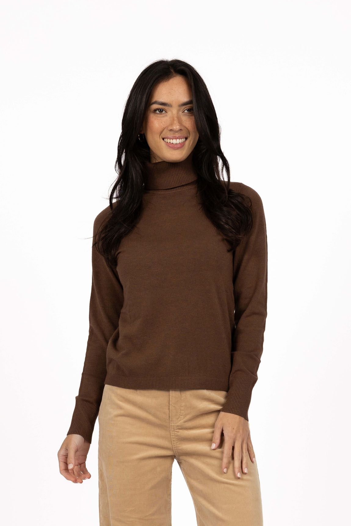 Model in studio wearing Alana Skivvy in Chocolate with Va Va Velour Pant in Camel, close-up front view  