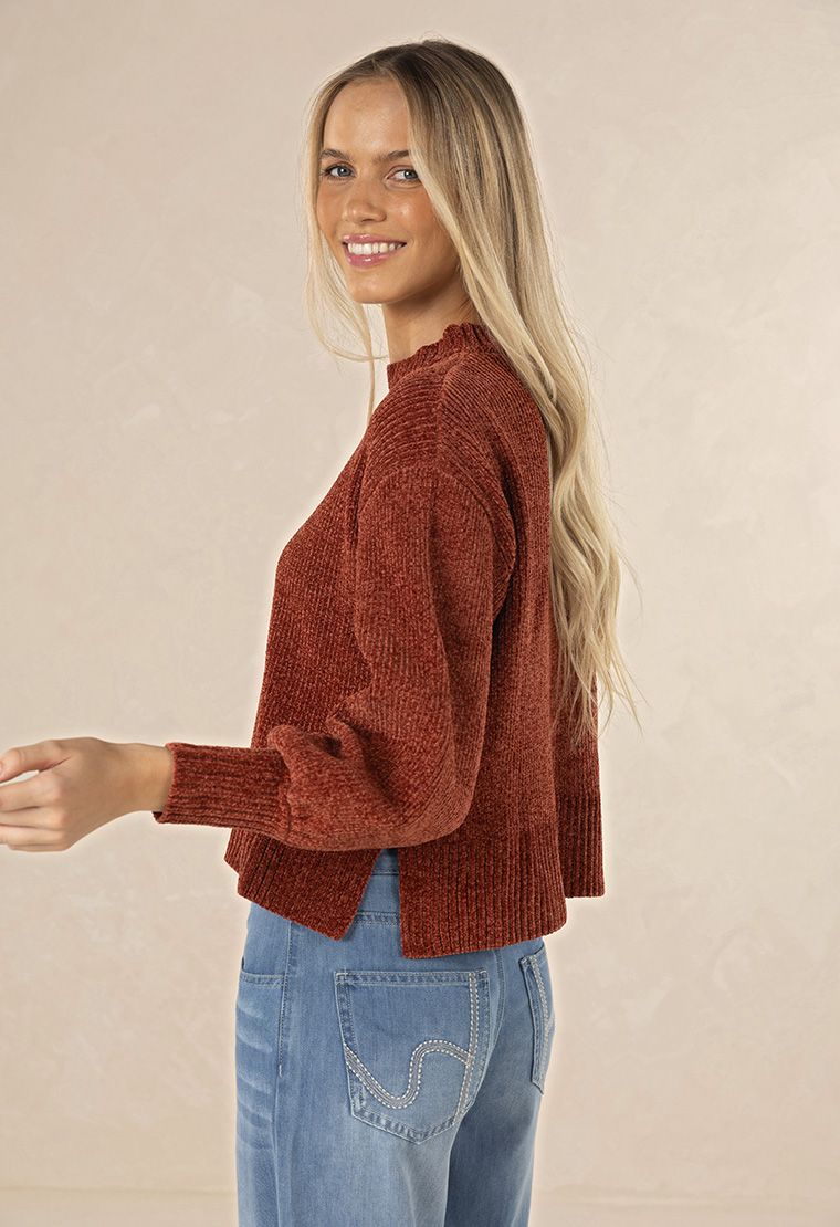Model in studio wearing Chenille Jumper in Rust with Ryder Jean, close-up back view  