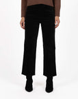 Model in studio wearing Va Va Velour Pant in Black with Rexie Jumper in Mocha and black boots, close-up front view  