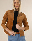 Model in studio wearing Gabi Jacket in Camel over black tee and Ryder Jean with tan Classic Belt, close-up front view 