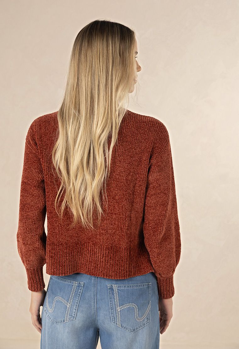 Model in studio wearing Chenille Jumper in Light Grey, close-up front view showing texture and ribbed hem 