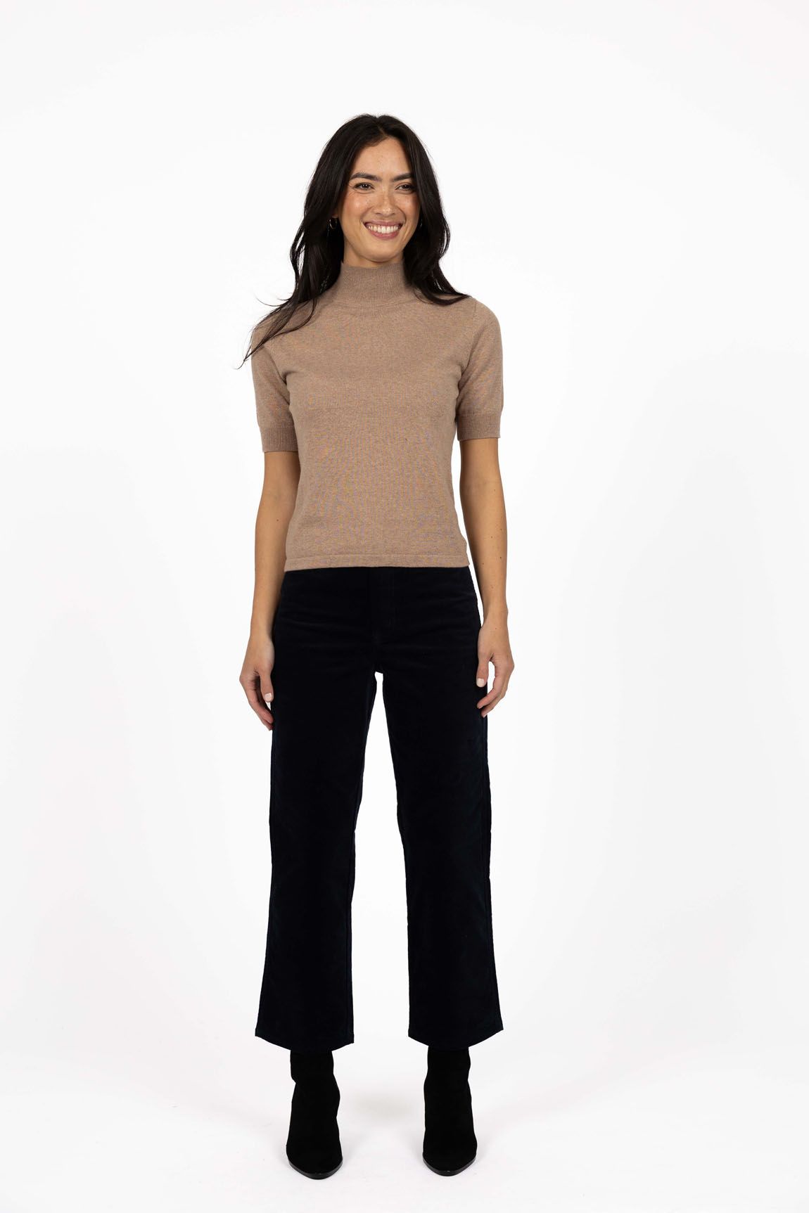 Model in studio wearing Va Va Velour Pant in Navy with Vera Top in Hazelnut and black boots, full-length front view 