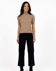 Model in studio wearing Va Va Velour Pant in Navy with Vera Top in Hazelnut and black boots, full-length front view 