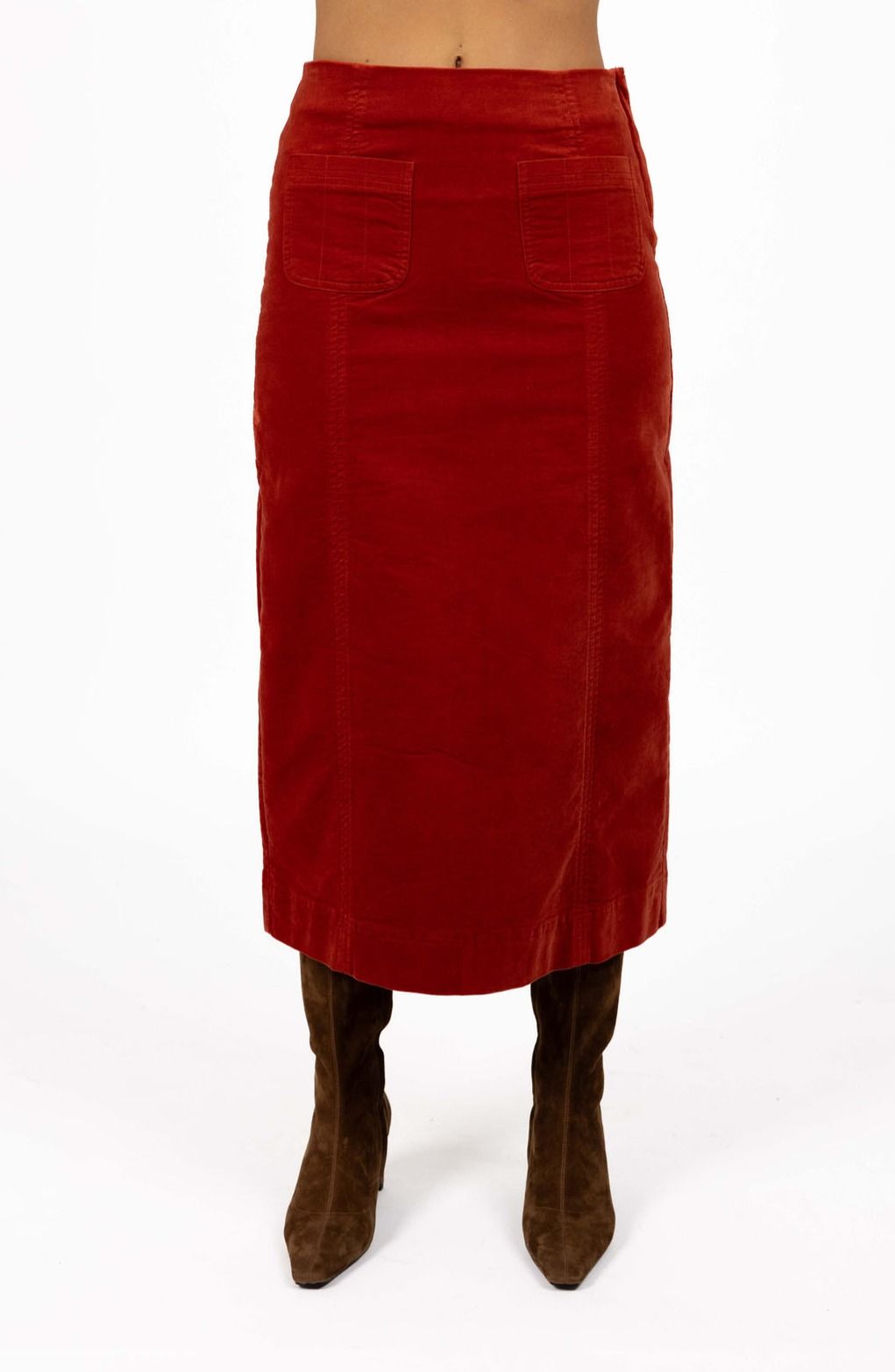 Model in studio wearing Va Va Velour skirt in Rust and brown boots, close-up front view showing straight silhouette  