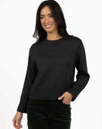 Model in studio wearing Rexie Jumper in Charcoal with Va Va Velour Pant in Khaki, close-up front view 