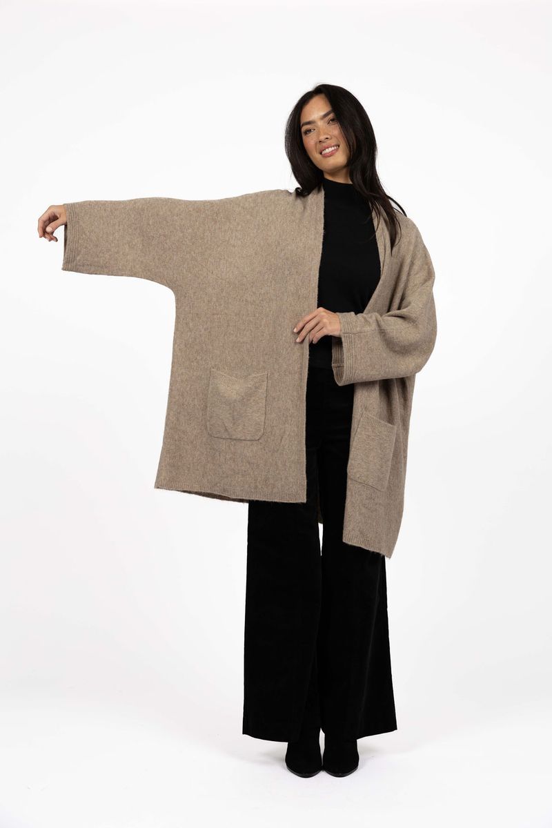 Model in studio wearing Rosha Cardi in Hazelnut over Va Va Velour Pant and Vera Top in Black, full-length front view showing oversized fit  